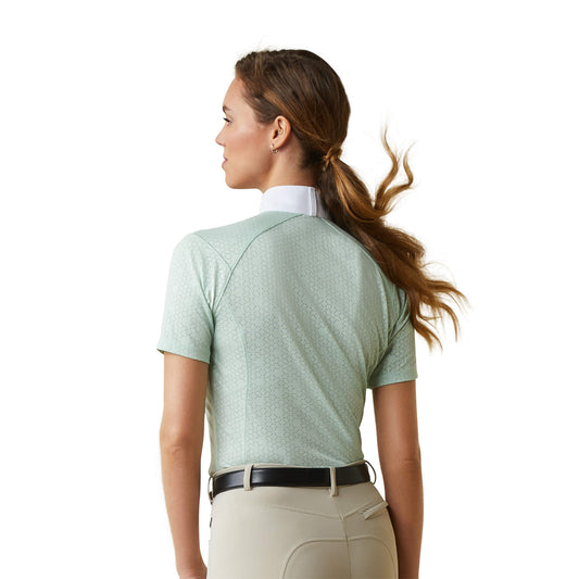 back view of a woman wearing an ariat equestrian showshirt in light green with white collar