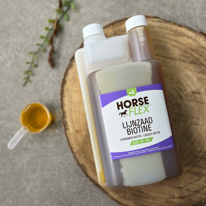 A bottle of Horseflex linseed and biotin oil on a wooden log background with a small sample pot of the oil